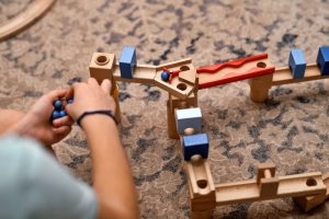 i_boy-playing-with-his-toys-indoors